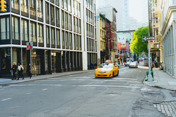 New York City cab driving through a street in SoHo, New York