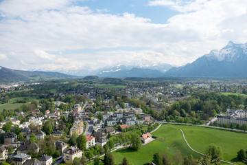Fototapeta na wymiar Aerial view houses in Salzburg city background mountain Alps