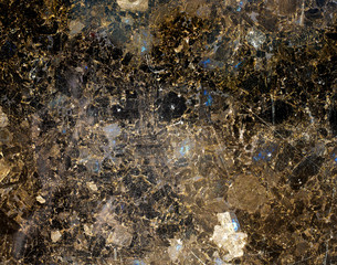 Black and gold patterned natural of dark marble background texture for design.