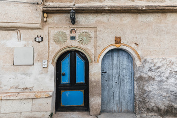 two wooden doors in traditional old building, cappadocia, turkey
