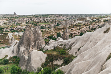 Fototapeta na wymiar aerial view of majestic landscape with famous rock formations in goreme national park, cappadocia, turkey