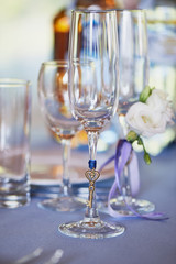 Glasses young. Decoration in the form of a metal suspension key