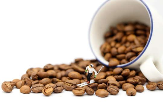 Miniature people :  Skiing On  coffee beans,relax concept.