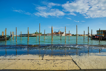 Landscape view of Adriatic Sea with boats and historic buildings in Venice, Italy, Europe.