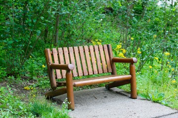 Fototapeta na wymiar A close view of the wood park bench.