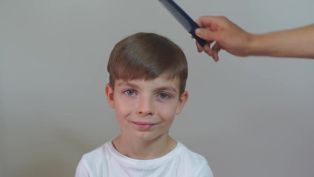 The boy is sitting at a reception with a trichologist. Home education. Quarantine viral infection COVID 19. Self isolation. Social distance.