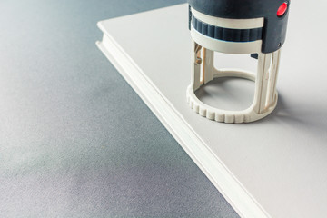 Ink stamp is on a gray book