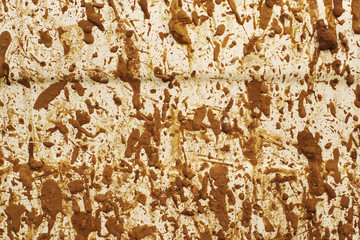 Splashes of dirt on a white surface