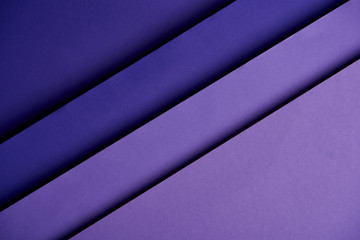 Fototapeta premium Pattern of overlapping paper sheets in purple tones