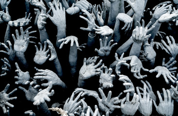 Hands from hell - Horror Background For Halloween Concept.
Zombie breakout - zombie hands rising from the darkness.