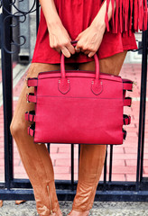 Fashionable woman on the street. City lifestyle. Female fashion.Stylish boho traveler woman wearing...