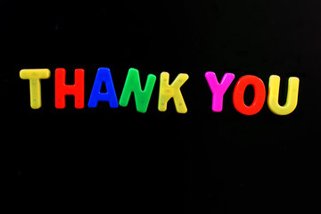 English letters in black background are the words thanks you