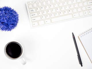 Modern white office desk table with keyboard computer, coffee and other office supplies of necessity, Top view with copy space