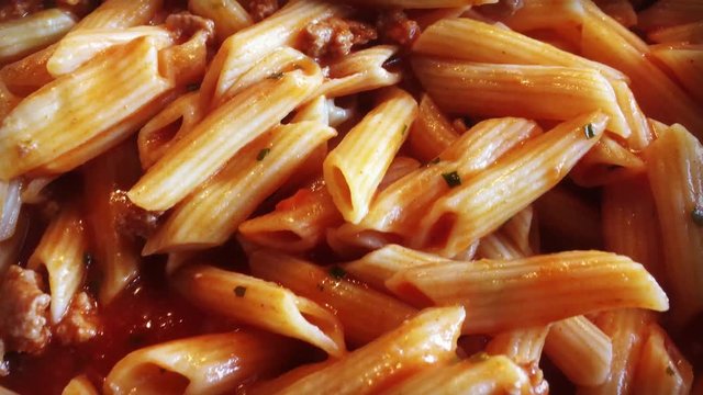 Cooking macaroni bolognese 4k video close up
