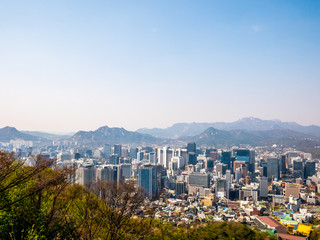 Panorama Seoul cityscape view from Namsan Hill.Blank space blue sky background.