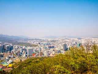 Panorama Seoul cityscape view from Namsan Hill.Blank space blue sky background.