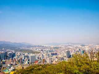Panorama Seoul cityscape view from Namsan Hill.Blank space blue sky background.