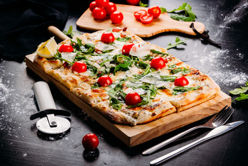Bright pizza with cheese and vegetables