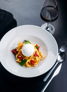 Tasty fettuccine with meat and goat cheese