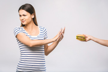Woman on dieting for good health concept. Woman doing sign no to refuse junk food or fast food...