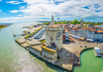 Seaside of La Rochelle dominated by Tour de la Lanterne and tour de la chaine, France - obrazy, fototapety, plakaty
