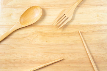 Wood chopsticks,fork and spoon wood background