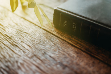 Soft focus The holy bible on wood table with copy space.christian background