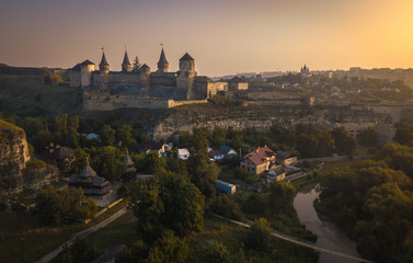 Kamianets-Podilskyi Castle during sunrise. Beautiful view of medieval fortress,  one of the Seven Wonders of Ukraine.