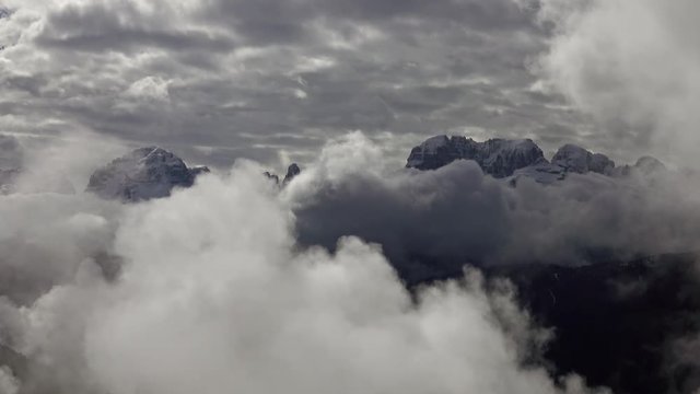 Snow-capped mountains in clouds landscape in alps, Adamello Brenta, Italy, 4k
