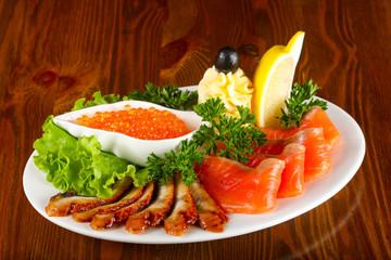 Trout fillet, red caviar and eel