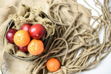 Fruit in a vintage basket basket with burlap