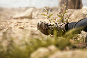 walking shoes during a break on a hike in the mountains while climbing