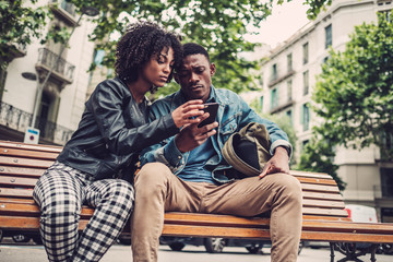 Young happy black couple outdoors