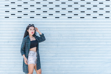 Obraz premium Portrait of beautiful asian woman,Hipsters girl for take a picture outdoor,Thailand people stand on stair