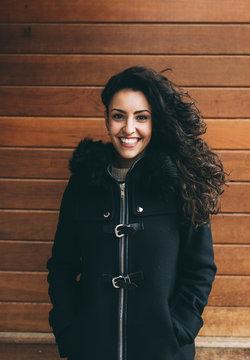 Trendy woman posing on wood logs