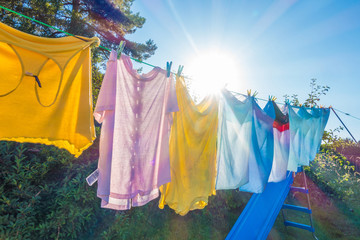 Fototapeta Clothes hanging to dry on a washing line in a back garden obraz
