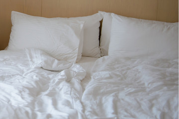 Crumpled bed linen in the morning. Bed for a couple in love.