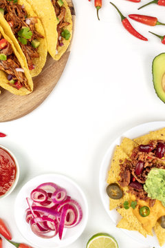 Overhead photo of typical Mexican dishes on white with copy space