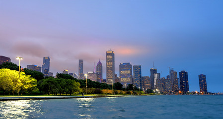 Naklejka premium Chicago, Illinois, USA - June 22, 2018 - The Chicago skyline at night after a storm across Lake Michigan.