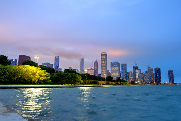 Fototapeta na wymiar Chicago, Illinois, USA - June 22, 2018 - The Chicago skyline at night after a storm across Lake Michigan.