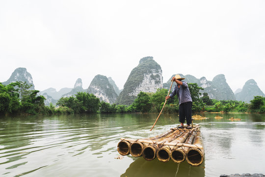 Chinese villager rafting on Qu&acirc;y Son river