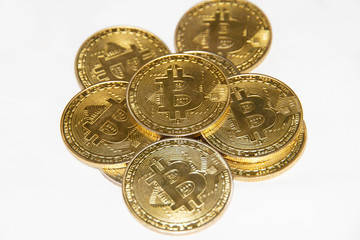 Golden bitcoin on white background 