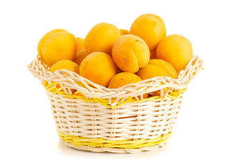 Apricots in a basket orange fruit on a white background isolation