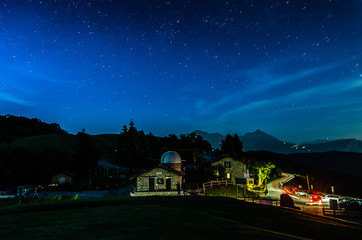Fototapeta na wymiar startrail over an astronomical observatory, in the city of Sormano.tif