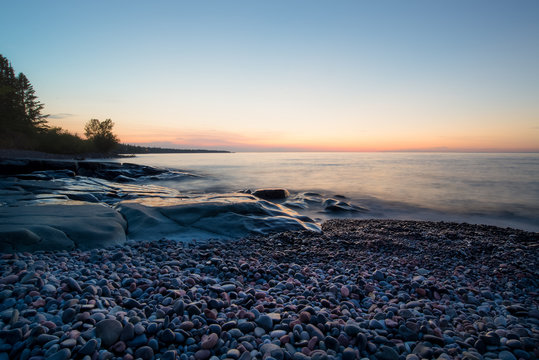 horizontal image, sunrise on Lake Superior in northern Minnesota USA. 