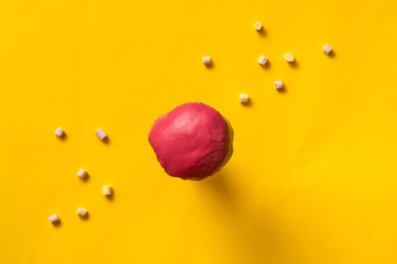 colored glazed donut and marshmallow fall or fly in motion against a pink and yellow pastel background. Concept of food, colorful breakfast. Macro concept,closeup, copy space