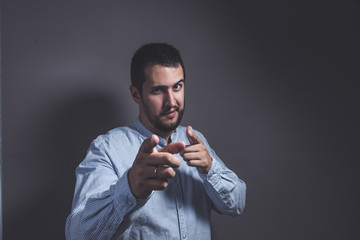 boy with positive expression pointing with fingers