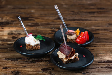 Three kinds of sandwiches from black bread with pâté