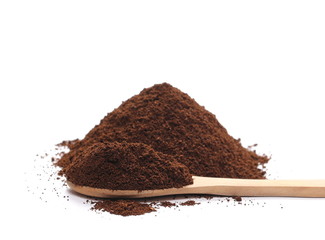 pile instant coffee in wooden spoon isolated on white