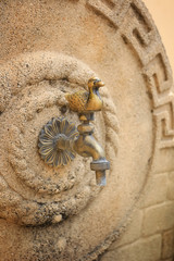 A crane in the wall for water, in the form of a bird, the island of Rhodes, Greece